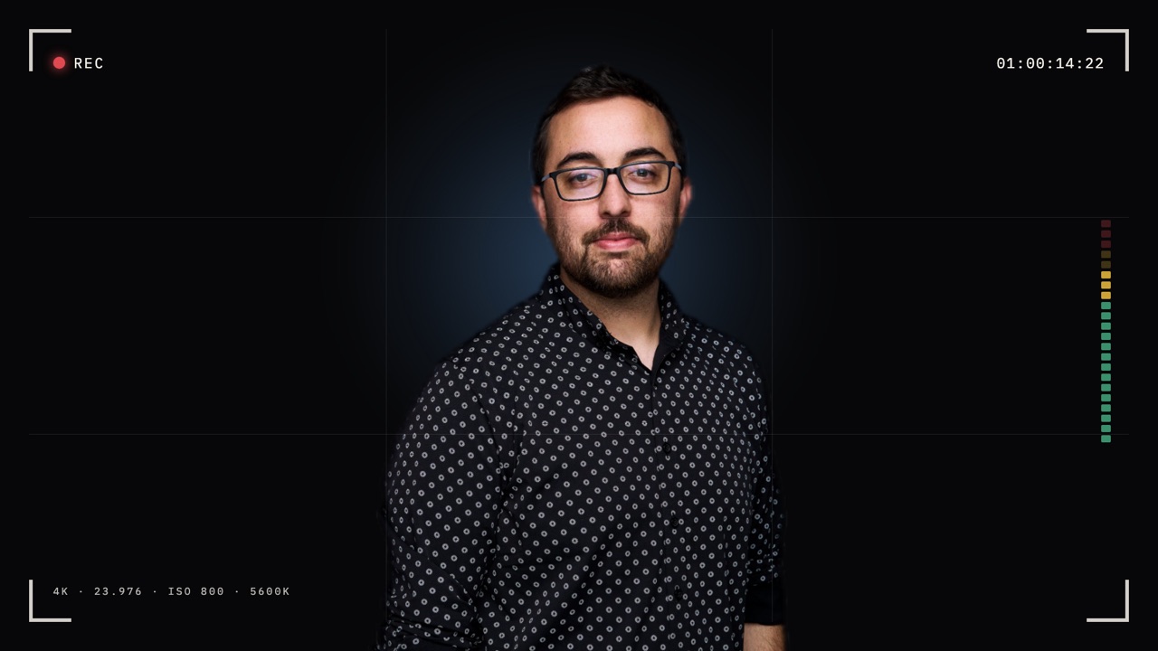Chris Cardoza, director and editor, framed in a camera viewfinder